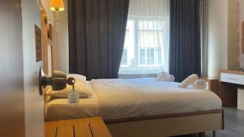 Economy Double or Twin Room, 1 Bedroom | Desk, laptop workspace, blackout curtains, iron/ironing board