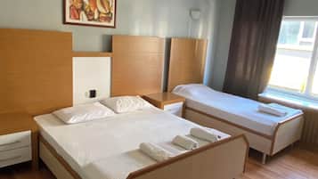 Desk, laptop workspace, blackout drapes, iron/ironing board