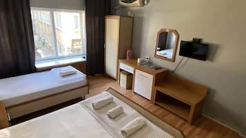Economy Room, 1 Twin Bed | Laptop workspace, blackout drapes, iron/ironing board, free WiFi