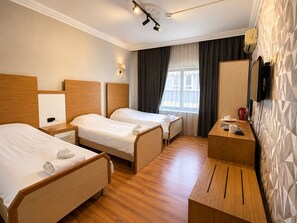Economy Quadruple Room, 1 Bedroom | Desk, laptop workspace, blackout drapes, iron/ironing board - Mola Otel (Balikesir)