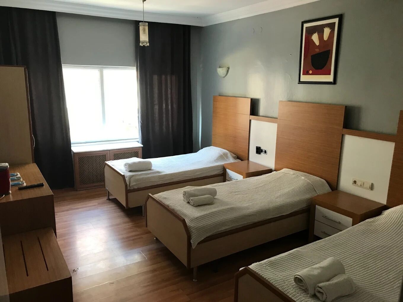 Desk, laptop workspace, blackout drapes, iron/ironing board