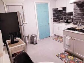 Microwave, stovetop, coffee/tea maker, cookware/dishes/utensils