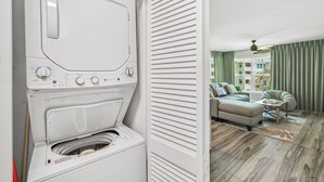 A modern laundry room with a front-loading washing machine. - Newly updated!! 2 Bed 2 Bath Beach View! (Destin)