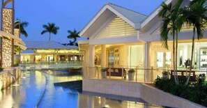 A luxury shopping area with a pool, shops, and a distance of 4 miles, 8 minutes from the viewer's location.