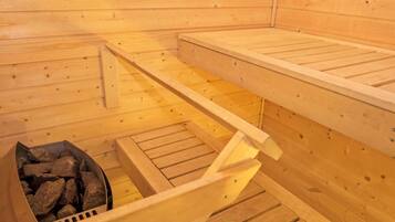 A sauna with wooden walls and benches.