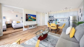 A modern apartment with a living room, dining area, and kitchen. - 34th floor lanai w/ pool & hot tub access (Honolulu)
