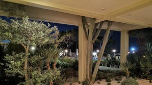An indoor garden with various plants and a tiled floor. - Louis Luxury Villa (Rhodes)