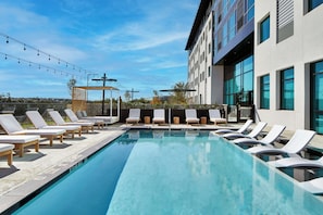 Outdoor pool, open 6:00 AM to 11:00 PM, pool loungers