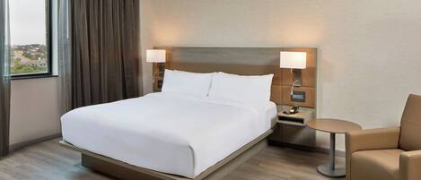 Premium bedding, down duvets, in-room safe, desk