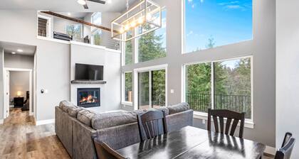 Secluded home with deck, grill, hot tub, fireplace, private beach, & W/D