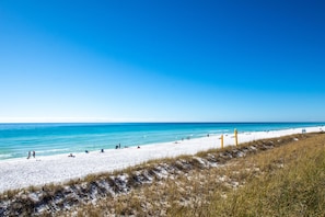 A beach with white sand and clear blue water. - Summer Breeze 312 1 Bedroom Condo by RedAwning (Miramar Beach)
