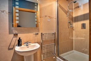 Shower, hair dryer, towels, toilet paper