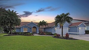 A two-story house with a front entrance, a garage, and a well-maintained lawn. - /\ Amazing Location/\ 10 mins away from beach and Mercato/ New Diamond in Naples (Naples)