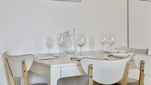 A dining table with four chairs, a pitcher, and four wine glasses set for four. - #AV | The Ladybug 🐞| Terrace |Tout équipé (Meylan)