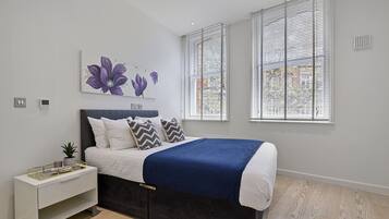 Apartemen, 1 kamar tidur | Brankas dan dilengkapi dengan perabotan berbeda-beda