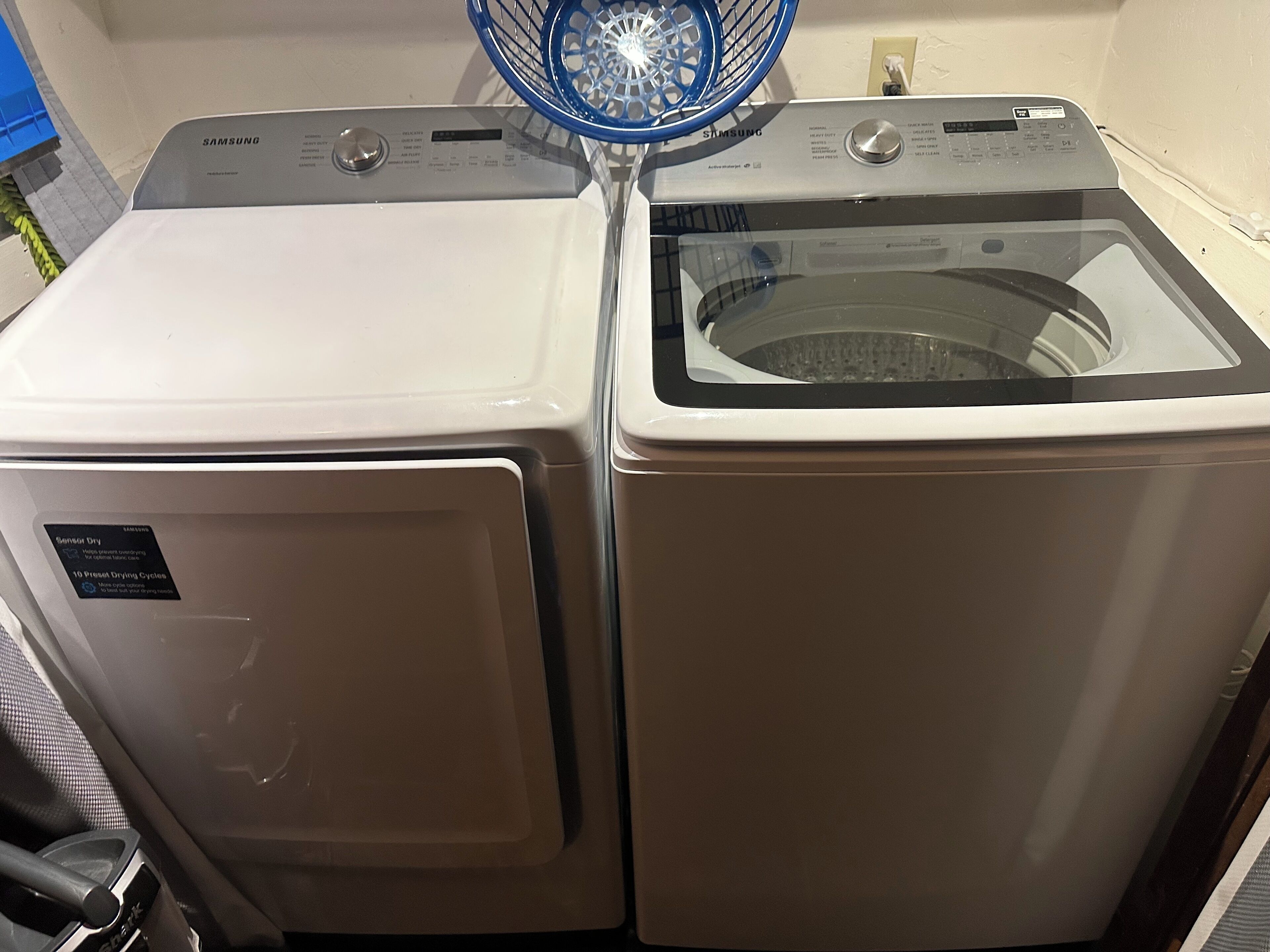 A front view of a Samsung washing machine and dryer unit.
