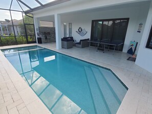 Outdoor pool, a heated pool - Flamingo House!! 4bedrooms/3 Bath. Pool/Spa. 6 minutes Walking to the Beach! (Marco Island)