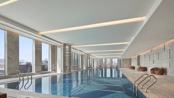 Indoor pool, open 6:00 AM to 11:00 PM, pool loungers