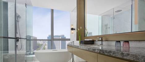 Executive Suite, 1 Bedroom, City View | Bathroom | Separate tub and shower, hydromassage showerhead, designer toiletries