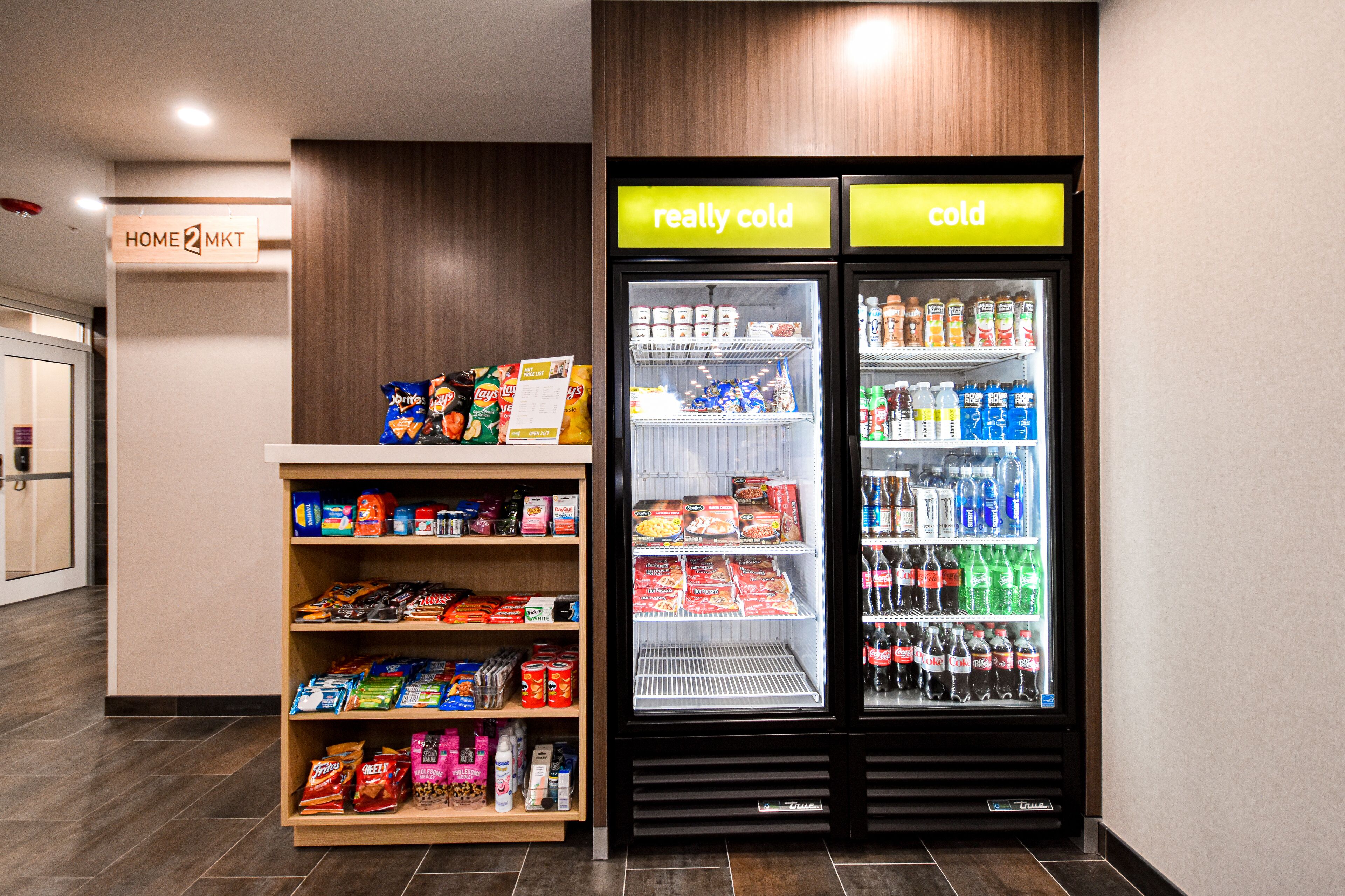 A vending machine area with snacks and a refrigerated display labeled "really cold" and "cold".