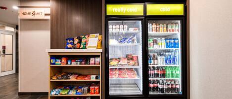 A vending machine area with snacks and a refrigerated display labeled "really cold" and "cold".