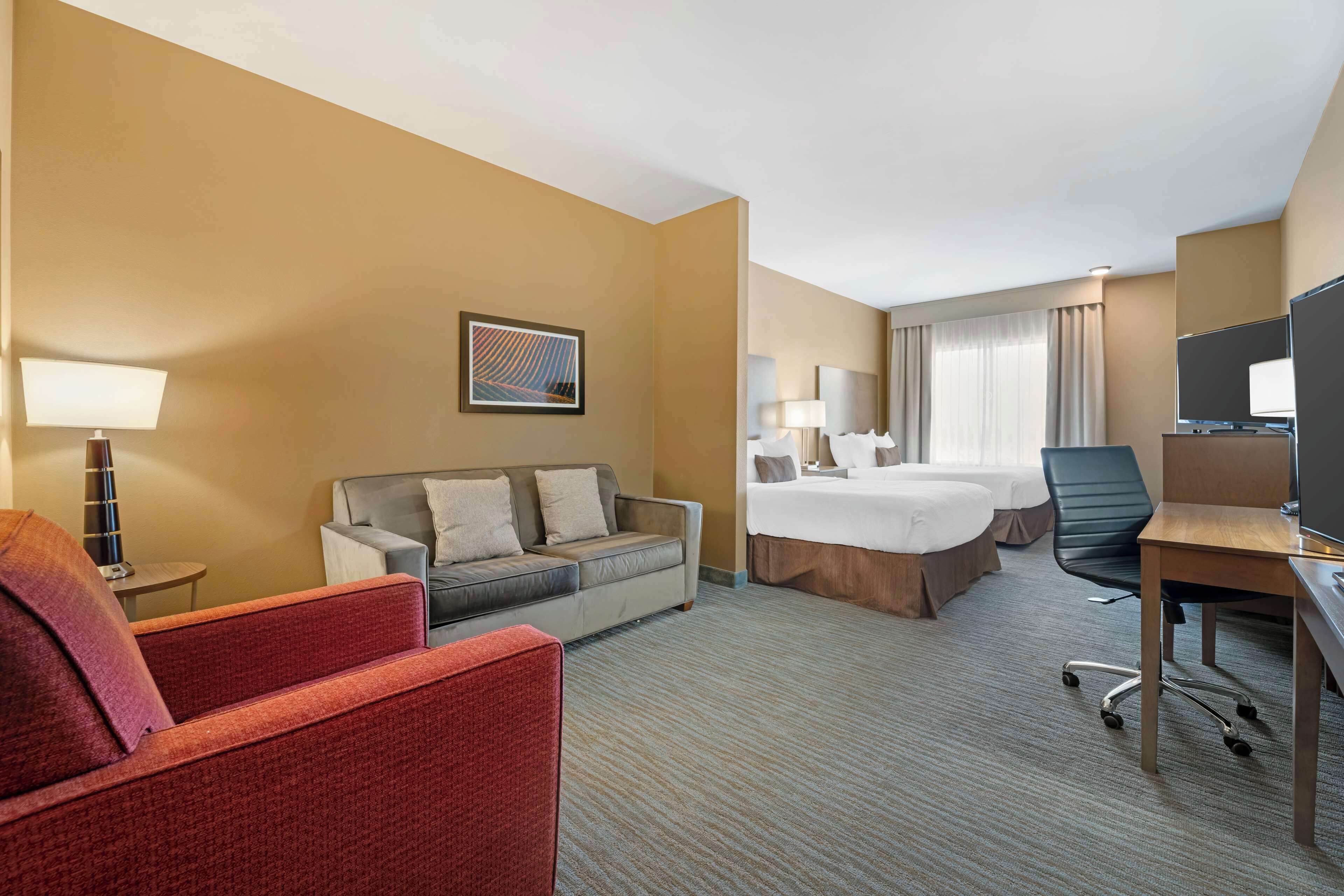 suite, 2 queen beds, accessible, refrigerator & microwave (with sofabed) | 1 bedroom, desk, laptop workspace, iron/ironing board