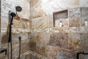Combined shower/bathtub, hair dryer, towels, toilet paper