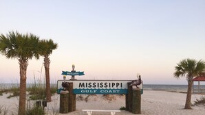 A beach entrance sign for Mississippi Gulf Coast with two pelicans on top. - 3 Bedroom Townhome 87B, one block to beach, close to casinos, & attractions (Gulfport)