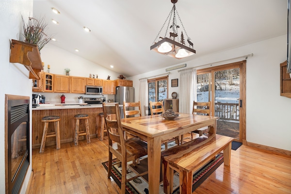Kitchen Dinning Room with 65 in flat screen.