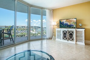 Enjoy breathtaking city views from the balcony, featuring a large sliding glass door.