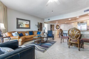 Relax in the stylish living room with a comfortable sofa, armchair, and coffee table.