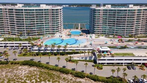 Relax by the central pool surrounded by sun loungers and shaded areas.