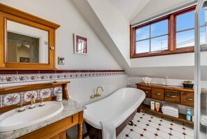 Bathtub, hair dryer, towels, soap