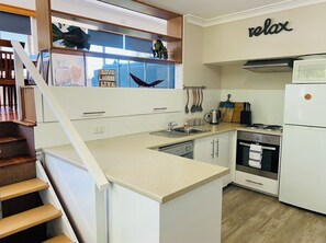 Enjoy cooking in this well-equipped kitchen with a stainless steel stove, oven, and dishwasher.