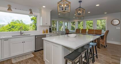 Large home with golf course view, open concept in living room with balcony