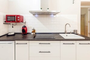 Fridge, microwave, stovetop, coffee/tea maker