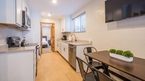 Coffee/tea maker, fridge, microwave, oven