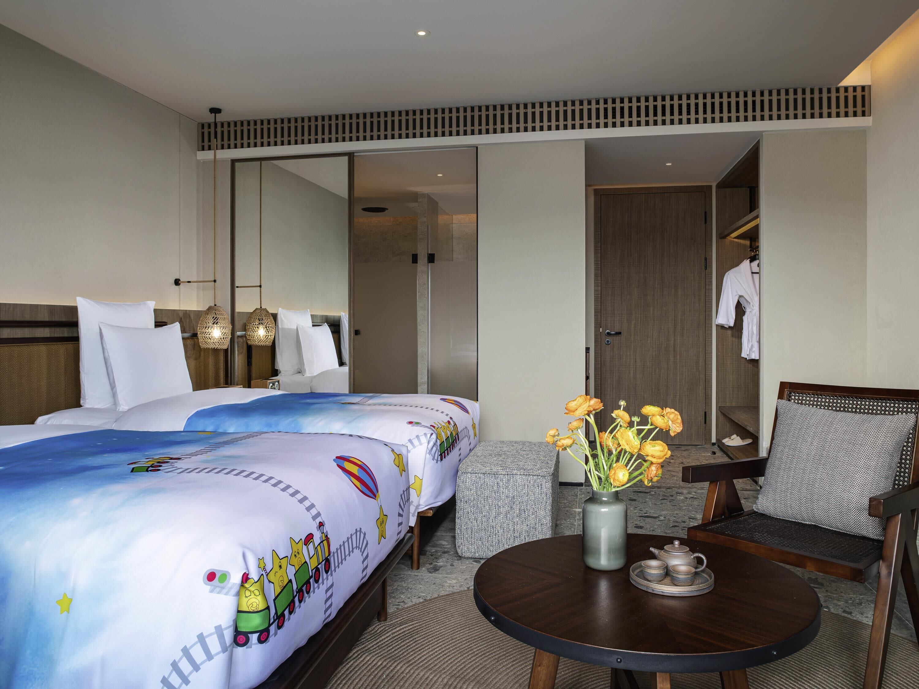 Luxe beddengoed, donsdekens, pillowtop-bedden, een minibar