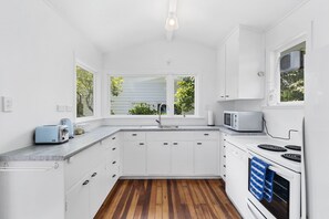 Fridge, microwave, dishwasher, toaster - Blue Gate Cottage - Waikanae Beach Holiday Home (Waikanae Beach)