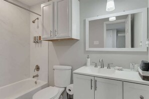 Bathtub, hair dryer, towels