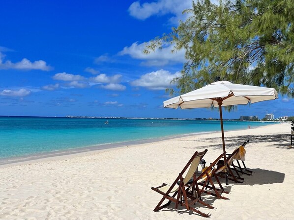 On the beach, sun loungers, beach towels