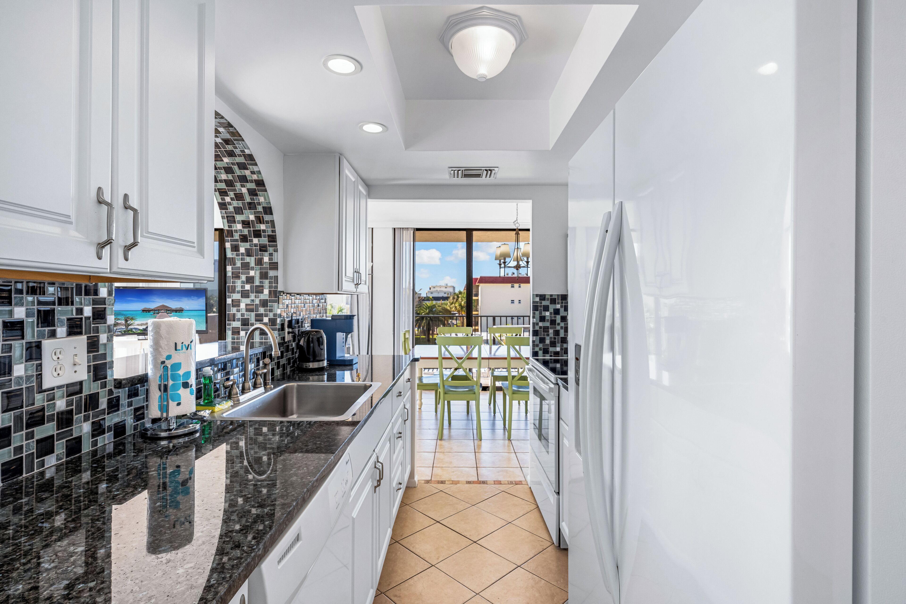 Condo (Our House at the Beach - 201W) | Private kitchen | Full-size fridge, microwave, oven, stovetop