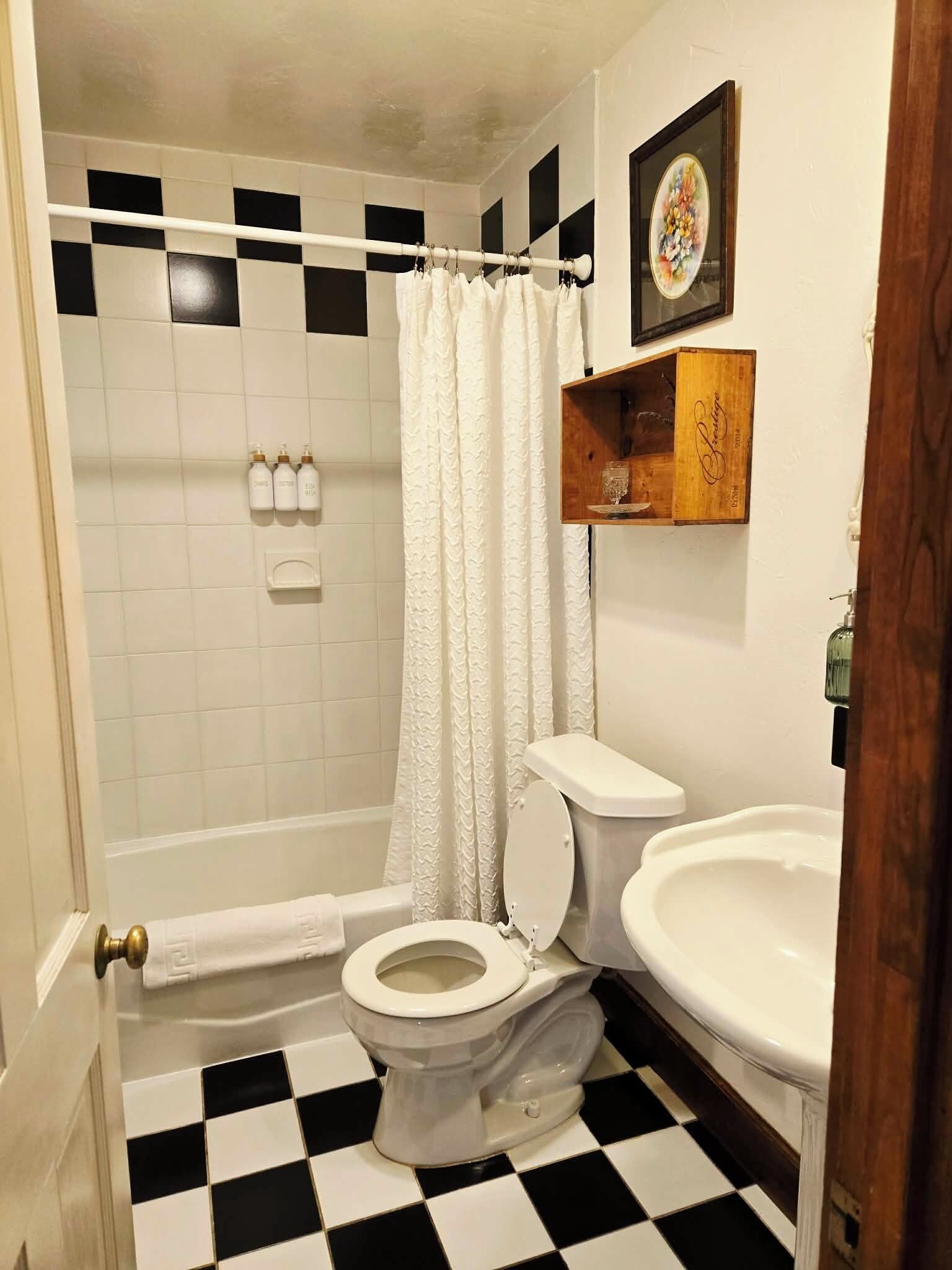 Combined shower/tub, hair dryer, towels, soap