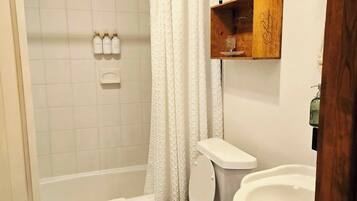 Combined shower/tub, hair dryer, towels, soap