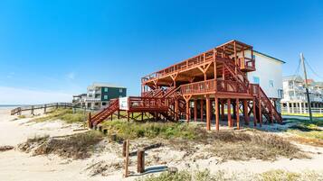 Enjoy stunning ocean views from the beachfront property's communal area or balcony.