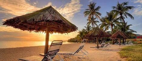 On the beach, sun-loungers, beach towels