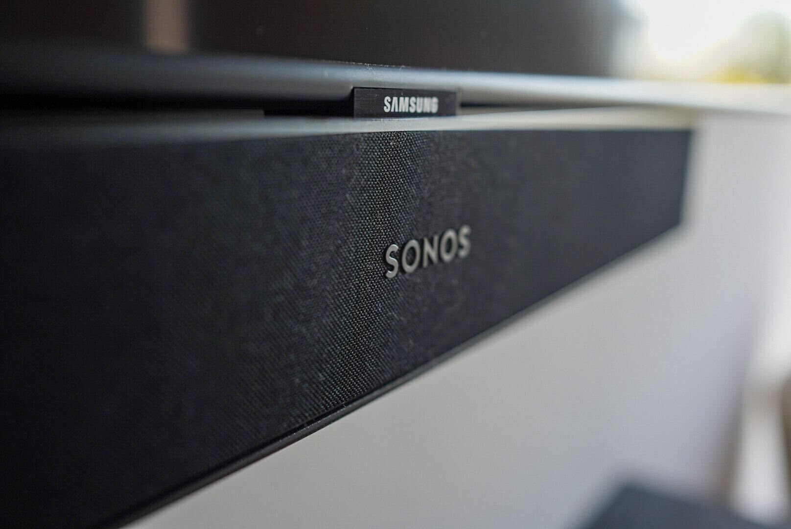 A black electronic device with the brand names "SONOS" and "SAMSUNG" visible.