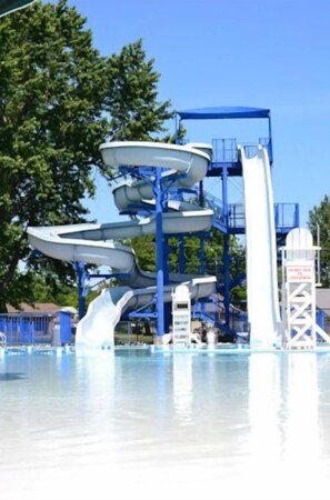 A water park with multiple water slides and a clear blue sky. - Dexter Victorian Homestead- Brand NEW Remodel April 2026. VERY Clean & Cozy (Dexter)