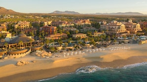 A coastal resort with multiple buildings, a beach with umbrellas, and a view of the ocean. - Gorgeous Views, 2 Masters, 3 more En Suites (Cabo San Lucas)