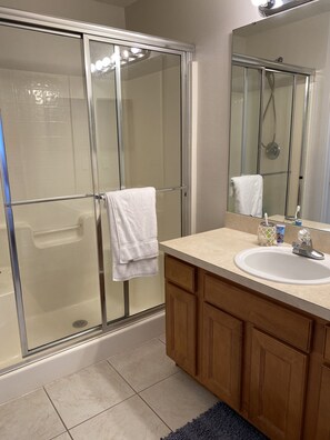 Combined shower/tub, hair dryer, towels, soap